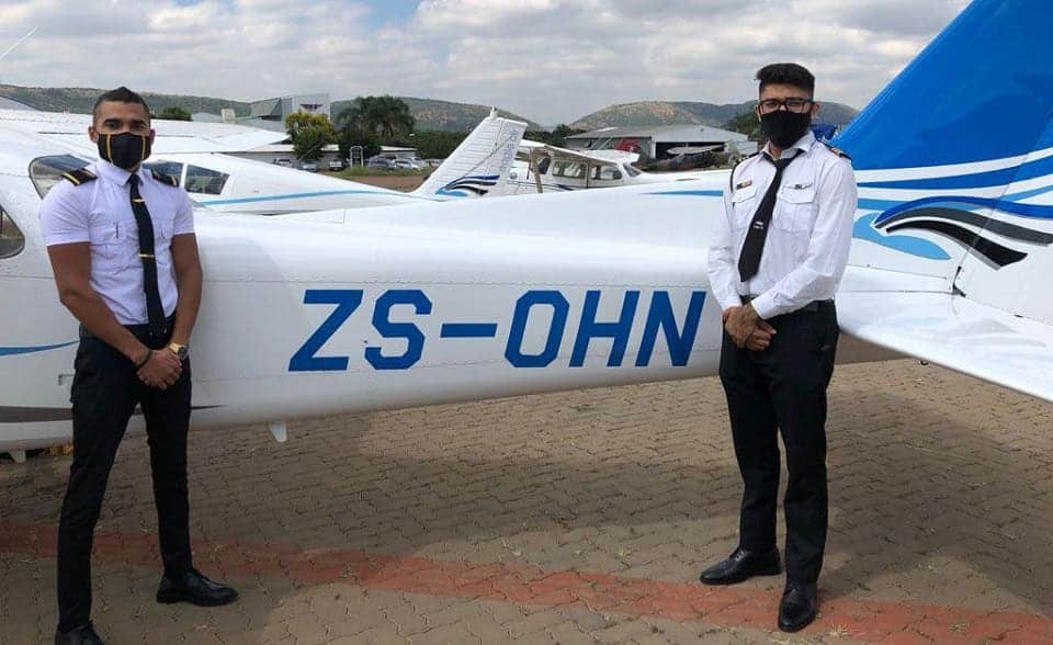 Training Equipment 1 Two Commercial Pilots Standing